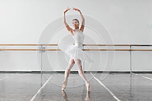 Beautiful ballerina rehearsal in ballet class photo