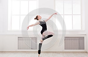 Beautiful ballerina stands in ballet pirouette