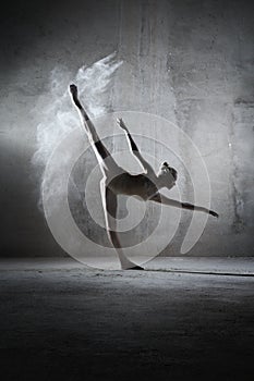 Beautiful ballet dancer pose with flour.