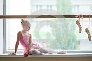 Beautiful ballet girl in pink leotard.