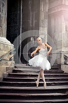 Beautiful ballet woman on stairs