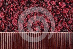 Beautiful bamboo mat on dry cranberry as agricultural background.