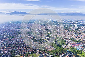 Beautiful Bandung cityscape on misty morning photo