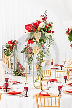 Beautiful banquet hall under a tent for a wedding reception. Interior of a wedding tent decoration ready for guests