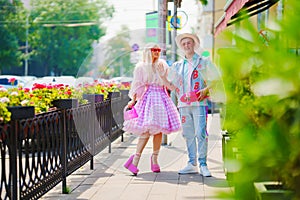 Beautiful barbie girl and boyfriend ken walking around the city