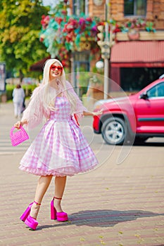 Beautiful barbie girl walking around the city