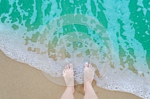 Beautiful bare feet on the beach