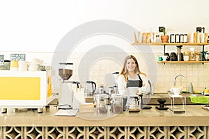 Beautiful barista in a coffee shop