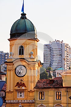 Beautiful Baroque clock tower with ugly skyscrapers in Croatia