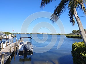 Beautiful bay front view with blue skies, water and boat