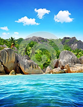 Beautiful beach Anse Source d`Argent with big granite rocks in sunny day. La Digue Island, Indian Ocean, Seychelles.