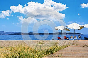 Beautiful beach background with chairs and umbrella, Greece Khalkidhiki