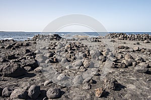 The beautiful beach of black and dark stones