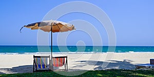 Beautiful beach. Chairs on the sandy beach near the sea. Summer holiday