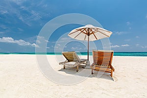 Beautiful beach. Chairs on the sandy beach near the sea. Summer holiday and vacation concept for tourism. Inspirational beach