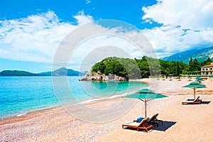 Beautiful beach with chaise lounges in near Budva, Montenegro