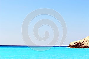 Beautiful beach with clear turquoise water on a sunny day in the Ionian Sea , Kefalonia,Greece.