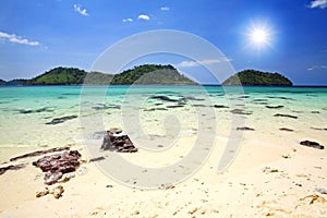 Beautiful beach and crystal sea against sunbeam