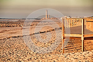 Beautiful beach with dunes and wooden walkway in Aveiro photo