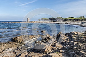 Beautiful beach in La Caletta with an ancient tower