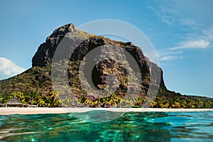 Beautiful beach, palm trees, and clouds on the horizon. Africa, Mauritius, South, near Le Morne