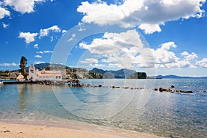 Beautiful beach at The Panagia Vlacherna church with a nice cloudscape in Corfu, Greece