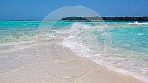 Beautiful beach with pristine turquoise water in Conflict Island, Papua New Guinea