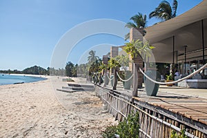 Beautiful beach resort bar at the Indian Ocean, amazing seascape with turquoise colors, palm trees and infinity pool