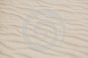 Beautiful beach sand pattern. Peaceful tropical nature pattern, sand texture. Calm beach