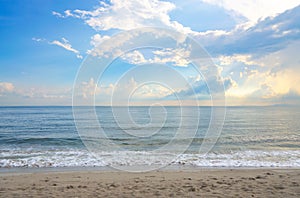 Beautiful beach and sky after the rain with the sun`s light penetrating through the clouds