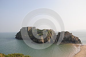 A beautiful beach in Tenby South Wales on a sunny summers day. Blue clear sky and tranquil sea.