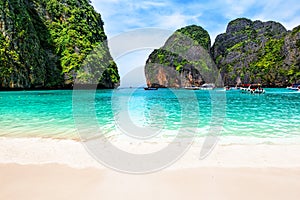 Beautiful beach with thai traditional wooden longtail boat and blue sky in Maya bay, Thailand