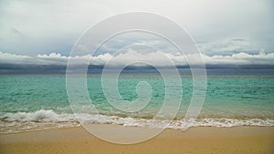 Beautiful beach on tropical island in stormy weather. Boracay island Philippines.