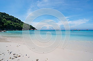Beautiful beach and tropical sea with wave crashing on sandy shore Small island archipelago at Similan national park Thailand