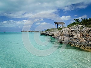 beautiful beach with turquoise water and rocks and trees in the