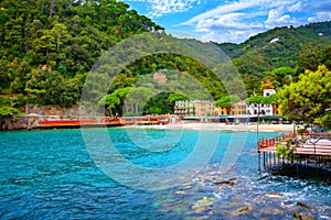 Beautiful beach with turquoise water in small bay. Portofino, Liguria, Italy