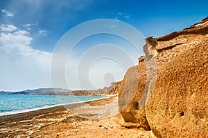 Beautiful beach with unusual volcanic mountains and turquoise wa