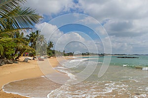 Beautiful beach. View of nice tropical beach with palms around. photo
