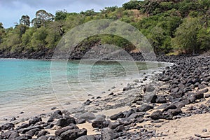 Beautiful beach with volcanic rocks and clear water in Sao Tome and Principe Island, in Africa