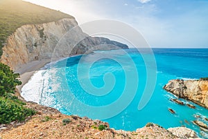 Beautiful beach and water bay in the greek spectacular coast line. Turquoise blue transparent water, unique rocky cliffs, Greece