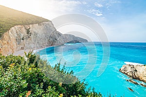 Beautiful beach and water bay in the greek spectacular coast line. Turquoise blue transparent water, unique rocky cliffs, Greece