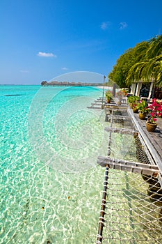 Beautiful beach with water bungalows at Maldives.