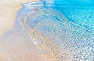 Beautiful beach with white sand, clear blue sea water and calm waves