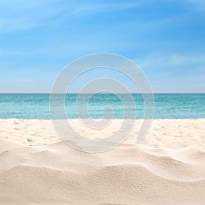 Beautiful beach with white sand near ocean, closeup photo