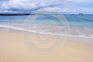 A Beautiful Beach and Yachts on Baltra photo