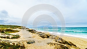 The beautiful beaches on False Bay along Baden Powell Drive between Macassar and Muizenberg near Cape Town