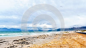 The beautiful beaches on False Bay along Baden Powell Drive between Macassar and Muizenberg near Cape Town