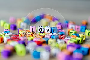 Beautiful beads colorful placed on the table as Love