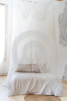 Beautiful bedroom with wooden four poster bed