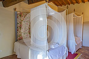 Beautiful bedroom with wooden four poster bed